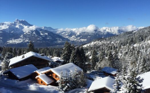 Chalet View With Clouded Mountains